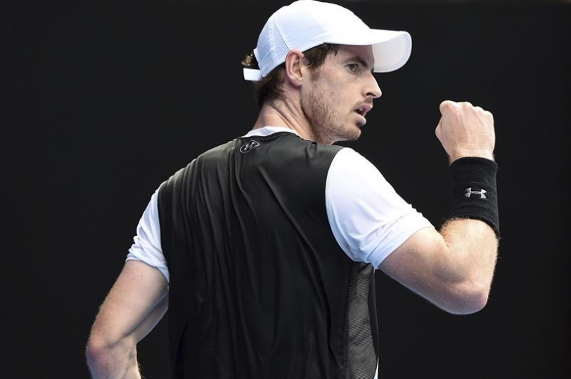  El tenista británico Andy Murray celebra una buena jugada ante el español David Ferrer